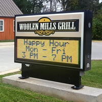 Business Sign for Woolen Mills Grill
